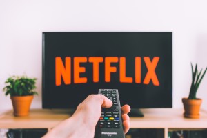 remote directed at t.v. displaying Netflix screen